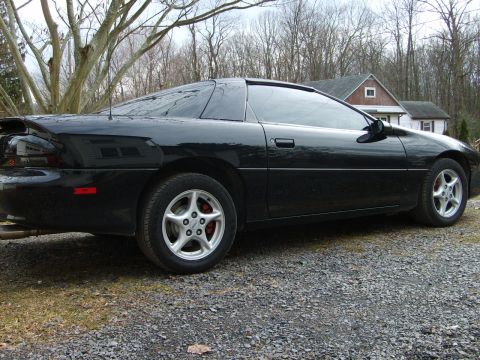 2002 Chevrolet Camaro - This black coupe, likely a 1998 model, is shown from the rear three-quarter angle.