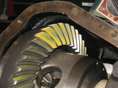 1990 Ford F-250 - The internal gears of a vehicle's differential are shown, some with yellow paint markings.