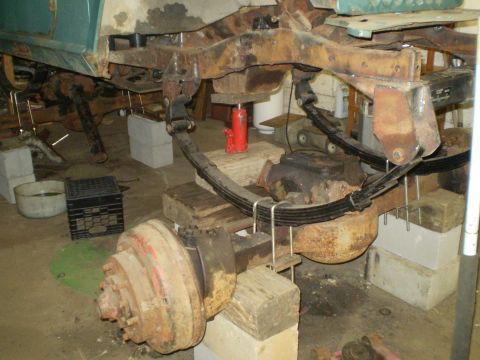 2005 Ford Excursion - Close-up of vehicle frame and suspension components undergoing repair or maintenance.