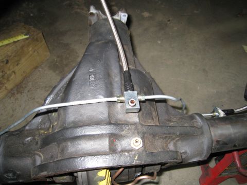1996 Ford Bronco - Close-up of a rear differential housing with brake lines connected.