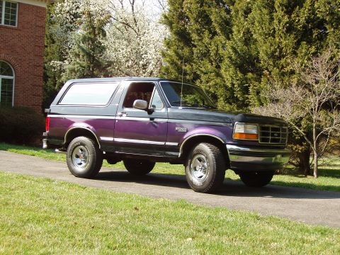 1993 Ford Bronco - This 1993 Ford Bronco features a distinctive two-tone paint scheme with purple and gray sections.