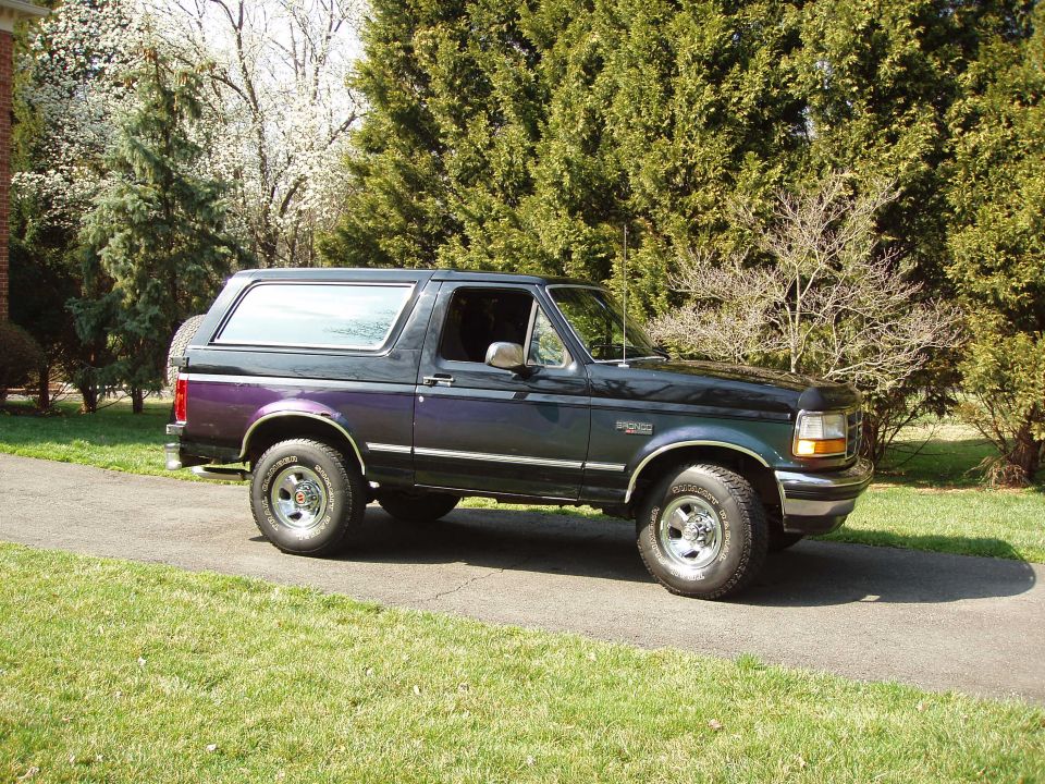 1993 Ford Bronco parked on driveway, side view