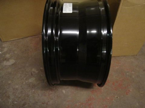 2000 Ford Crown Victoria - A black steel wheel rim is shown, likely a spare or replacement part.