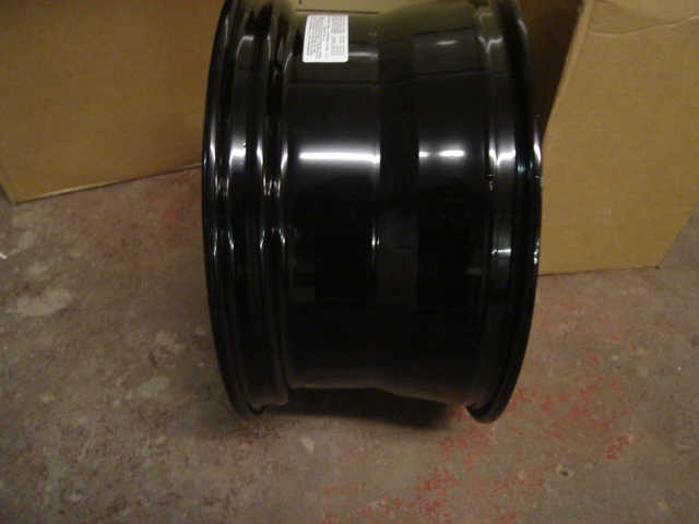 black steel wheel rim with a sticker on the side