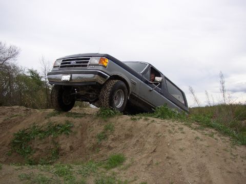 1989 Ford Bronco - This 1989 Ford Bronco is shown navigating an off-road course on a dirt hill.