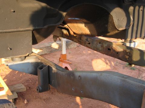 1980 Jeep CJ7 - Jeep frame and suspension components are visible, supported by jack stands.