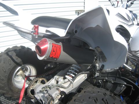 1995 Ford Bronco - Close-up of an ATV's exhaust system, a prominent 'BIG GUN' muffler.