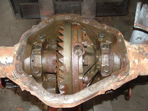1979 Ford Bronco - Close-up of a rusty differential assembly, showing internal gears and housing.