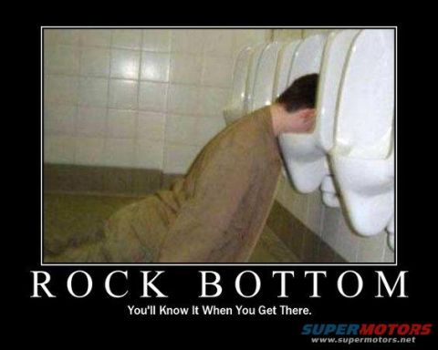 1995 Ford Bronco - A man is shown with his head in a urinal, with text overlayed that reads "ROCK BOTTOM" and "You'll Know It When You Get There."