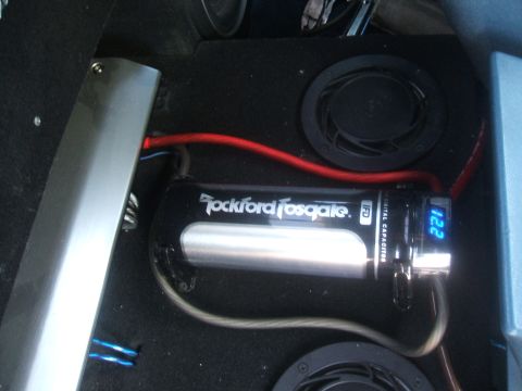 1974 Ford Ranchero - A Rockford Fosgate digital capacitor is visible with a blue LED display showing 12.2 volts.
