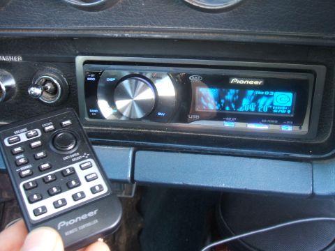 1974 Ford Ranchero - Close-up of a Pioneer car stereo and its remote control.
