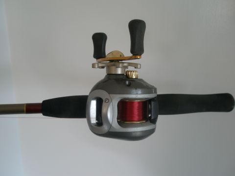 2007 Ford Bronco - Fishing reel and rod shown against a plain background.