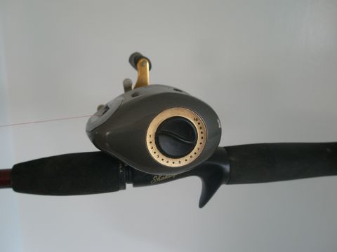 2007 Ford Bronco - A close-up view of a fishing reel, showing its intricate details and design.