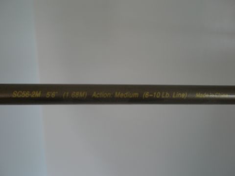 2007 Ford Bronco - Fishing rod details including model, length, action, and country of origin are printed on the shaft.