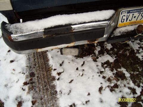1988 Ford Bronco - The rear bumper of a vehicle is covered in snow, with a Pennsylvania license plate visible.