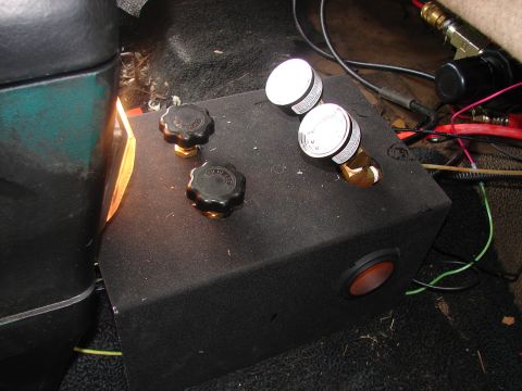1973 Ford Ranchero - Interior view of a custom air ride control box gauges and knobs, installed within a vehicle.