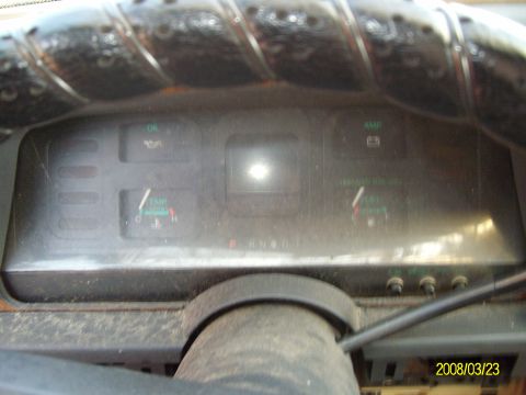 1986 Mercury Cougar - Interior view of a vehicle's dashboard, showing various gauges and indicators.