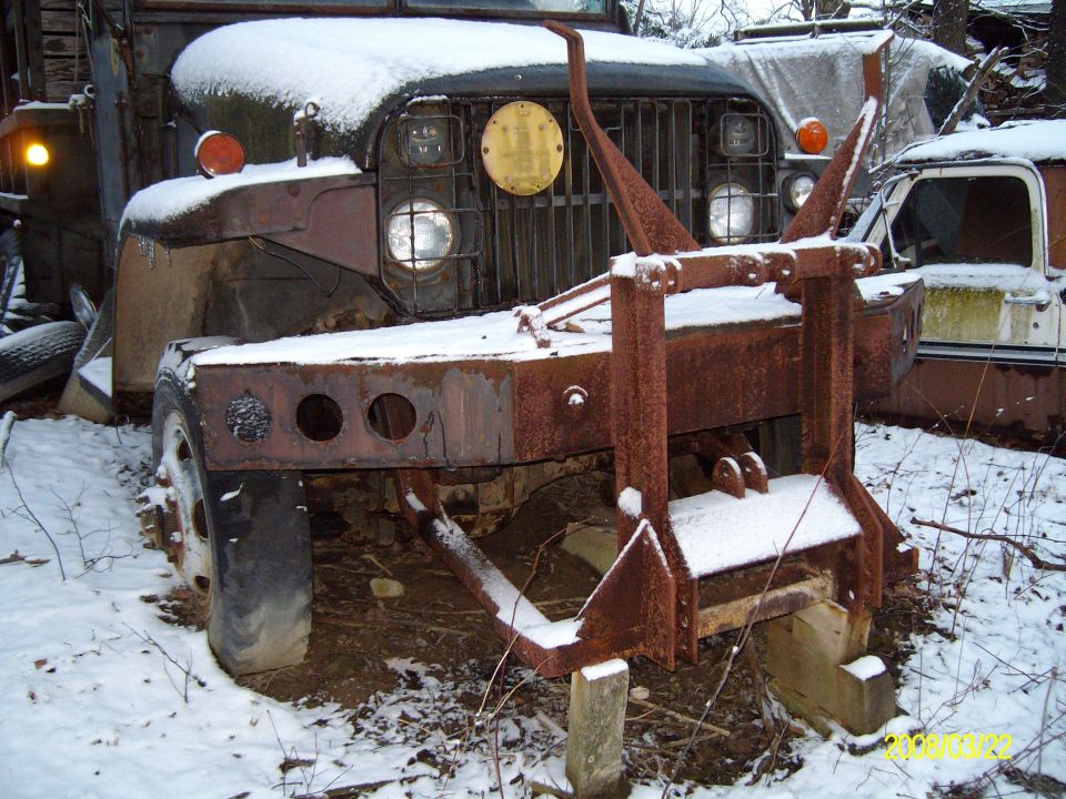 Old army truck my other grandfather owns. Has a chevy gaser engine in it and the block has a hole in the side of it. Just waiting on something to happen to it.

Possible bronco bumper in the future maybe? :D