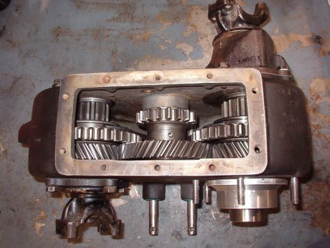 1975 Ford Bronco - 4WD High Both sliding gears (and the shift rails) are full forward, locking both outputs to the hi-speed (1:1)set of gears at the front of…