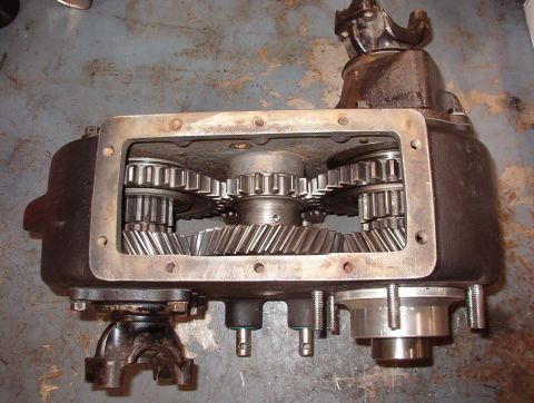 1975 Ford Bronco - 4WD Low Both sliding gears (and the shift rails) are full rearward, locking both outputs to the small end (low range) of the center idler g…