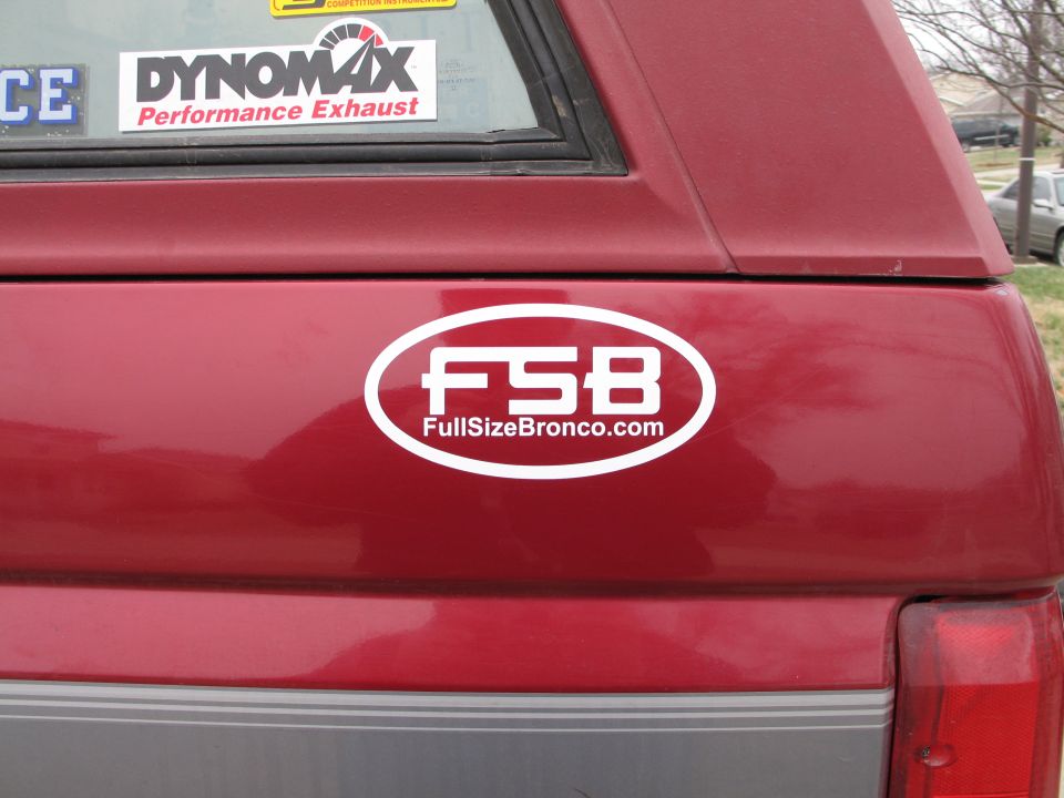 Red SUV rear with FSB FullSizeBronco.com sticker