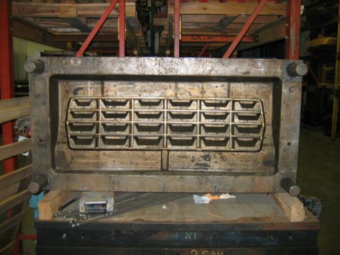 1992 Ford Mustang - This is a large industrial mold, likely for casting metal or plastic parts, a grid of 24 individual cavities.
