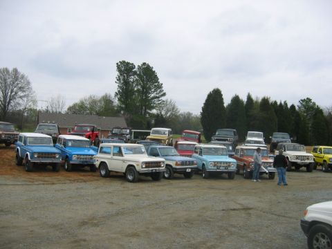 1992 Ford Mustang - A collection of Ford Broncos and other SUVs are parked in an outdoor lot.