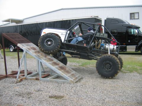 1992 Ford Mustang - Custom buggy with Ford Bronco body on a ramp, with a semi-truck in the background.