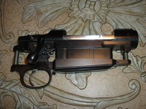 1991 Ford Bronco - The internal mechanism of a firearm, including the bolt action and trigger group, is displayed.