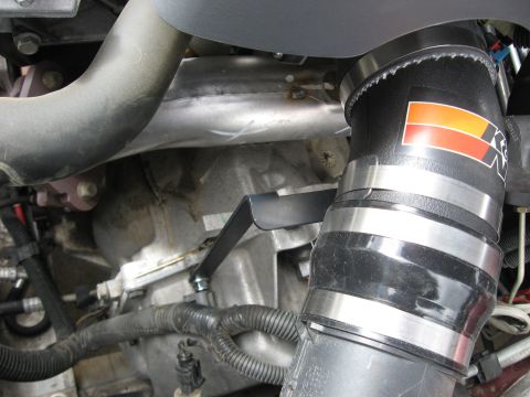 2004 Pontiac Grand Prix - Close-up of an engine's intake system, showing a K&N branded tube and manifold.