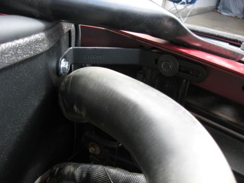 2004 Pontiac Grand Prix - Close-up of a hose and bracket assembly in the engine bay of a 2004 Pontiac Grand Prix, showing part number 010056.