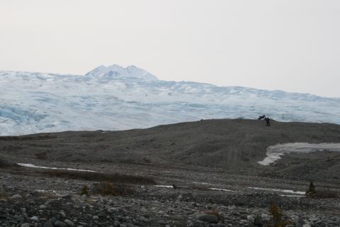 2003 Jeep TJ - A vast glacier stretches across the landscape, with distant mountains under a hazy sky.