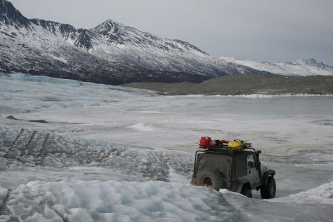2003 Jeep TJ - A Jeep TJ navigates a glacial landscape, equipped with extra fuel and gear for the journey.