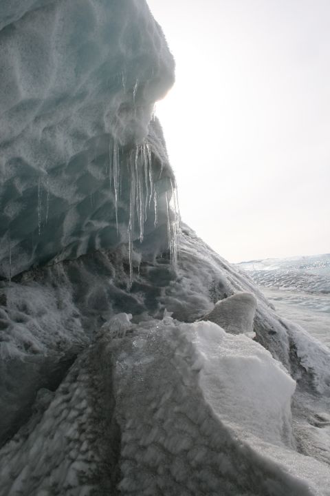 2003 Jeep TJ - Icicles hang from a glacial ice formation under a bright sky.