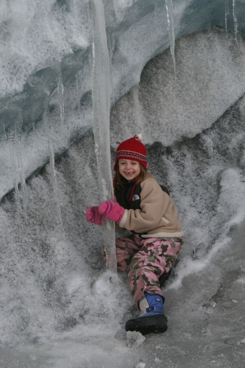 2003 Jeep TJ - A smiling child in winter gear poses against a backdrop of ice and snow.