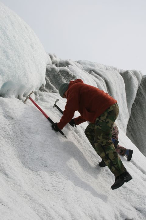 2003 Jeep TJ - Climbers ascend a glacier using ice axes and crampons.