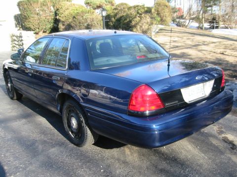 2003 Ford Crown Victoria - This 2003 Ford Crown Victoria is shown from the rear three-quarter angle.