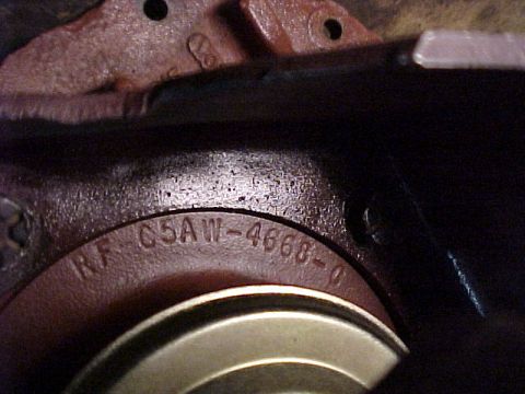 1968 Mercury Cougar - A close-up view of a cast iron component with visible casting numbers, likely from an engine assembly.