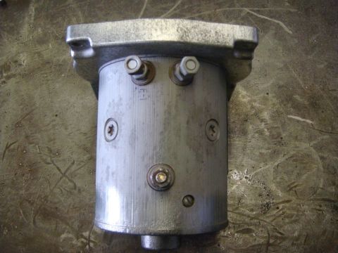 1996 Ford Bronco - A close-up view of a metal component with visible fasteners and markings.