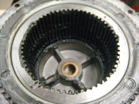 1996 Ford Bronco - This photo shows a damaged automotive differential gear assembly with visible wear and missing teeth.