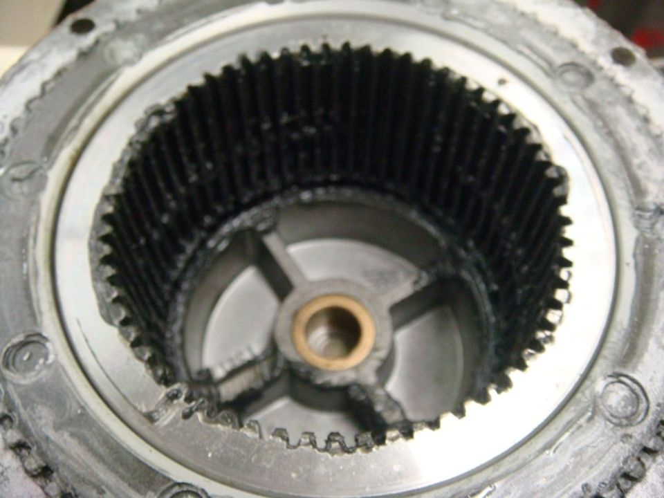 Close-up of a damaged gear assembly with missing teeth