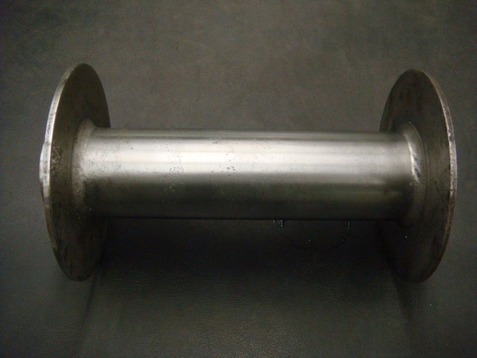Metal spool with two flat circular ends and a cylindrical center