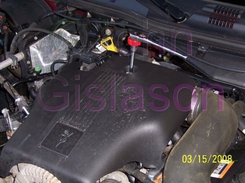 2004 Mercury Grand Marquis - Remove/Install Engine cover with a 1/4" ratchet and extension.