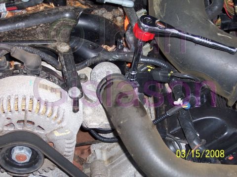 2004 Mercury Grand Marquis - Installing water outlet elbow and bolts.