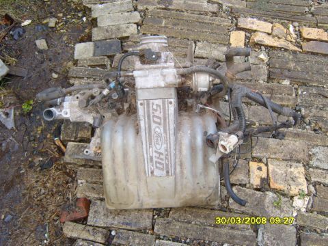 1989 Ford Bronco - This image shows a Ford 5.0 HO engine intake manifold, identified by its distinctive badging.