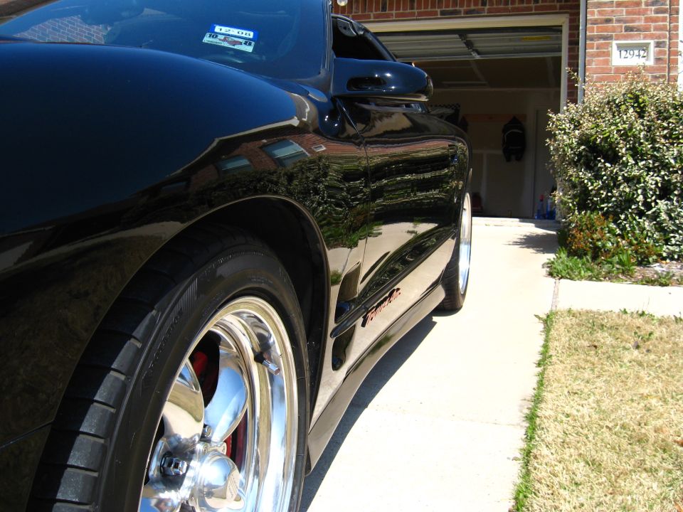 Black 2002 Pontiac Trans Am parked in driveway