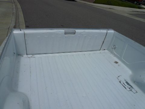 1975 Ford Ranchero - Interior view of a pickup truck bed, showing the ribbed floor and side panels.