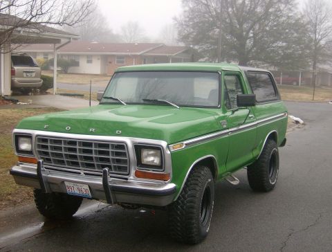 1979 Ford Bronco - A green 1978 Ford Bronco is shown from a three-quarter front view on a foggy day.