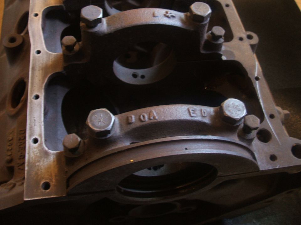 Close-up of engine block with stamped letters DOA ED