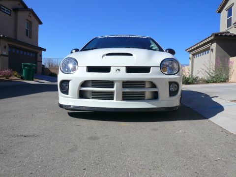 1996 Ford Probe - Front view of a white Dodge Neon SRT-4 parked on a residential street.